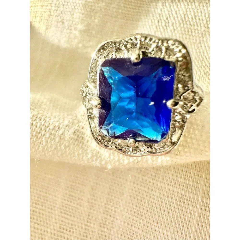 Bright blue cubic zirconia elongated radiant cut cocktail ring